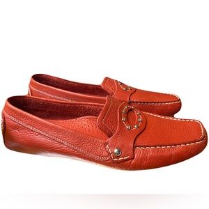 This is a pair of red Cole Haan leather driving loafers